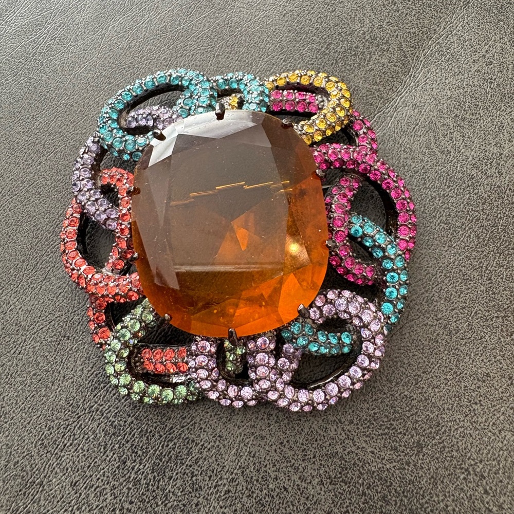 Joan Rivers Multi-colored Crystal Swirls and large Amber Center Brooch